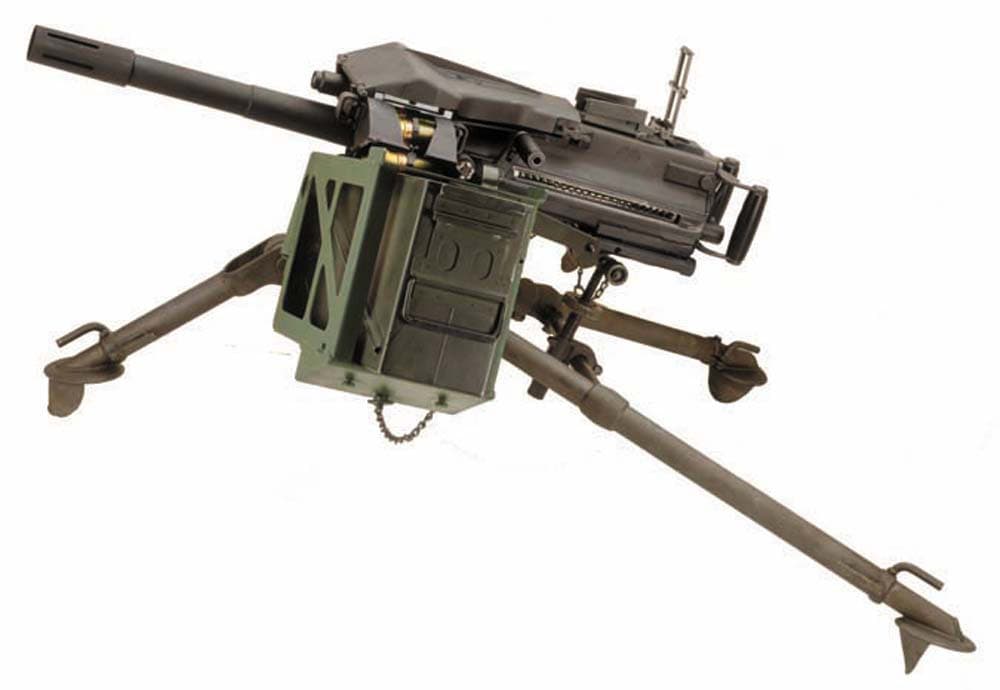 An MK 19-02 grenade launcher mounted on a tripod.