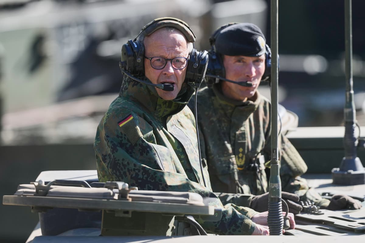 Chancellor Friedrich Merz of Germany rides in an armored fighting vehicle during a visit to an army base at Munster, Germany, on April, 30, 2026.