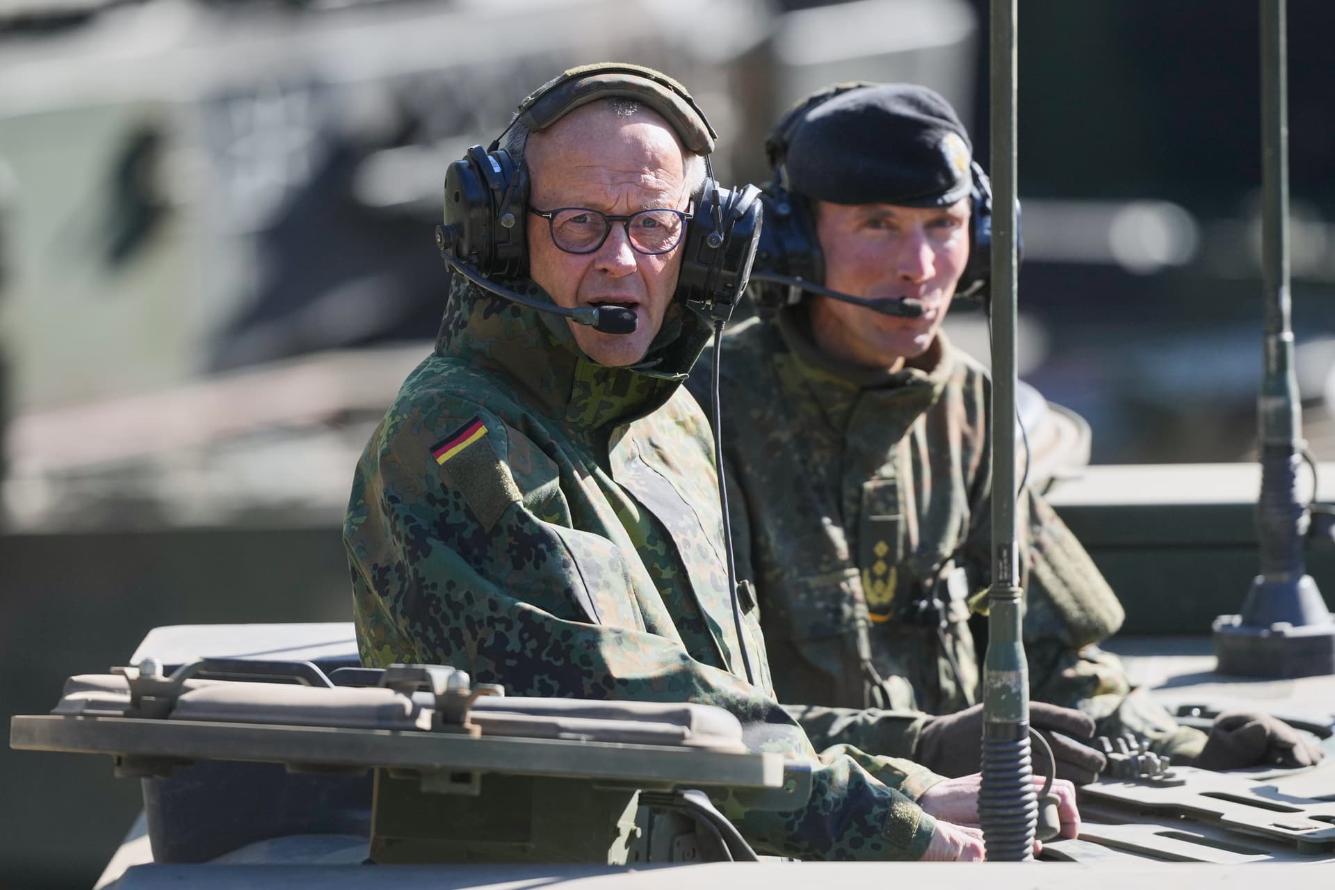 Chancellor Friedrich Merz of Germany rides in an armored fighting vehicle during a visit to an army base at Munster, Germany, on April, 30, 2026.