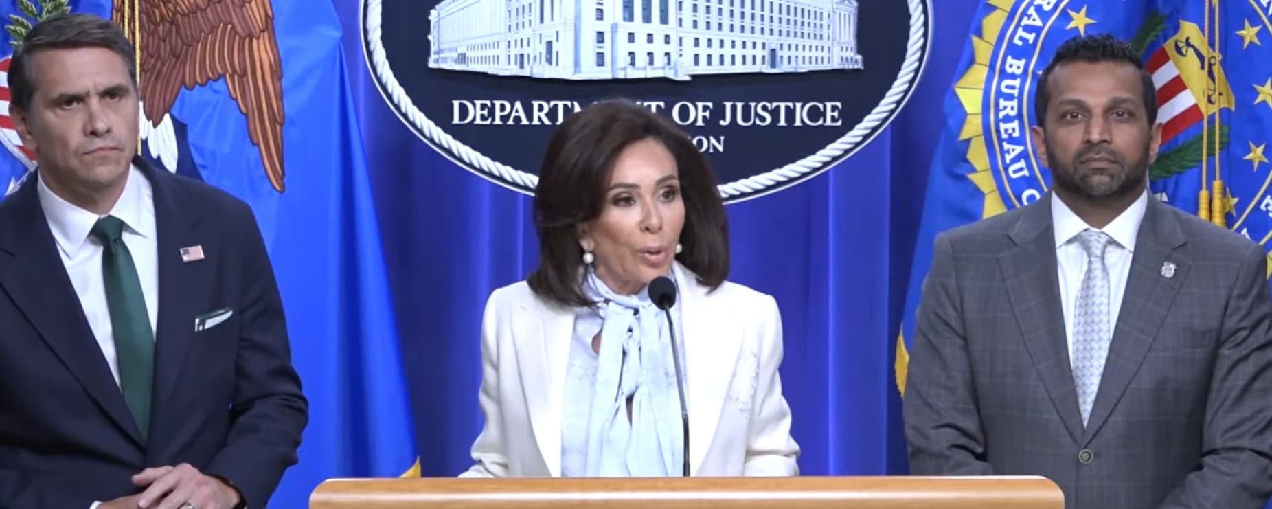 A screengrab from the press conference in which Acting Attorney General Todd Blanche, FBI Director Kash Patel, and U.S. Attorney Jeanine Pirro announced federal charges on April 27, 2026, against the alleged gunman at the White House Correspondents Dinner.