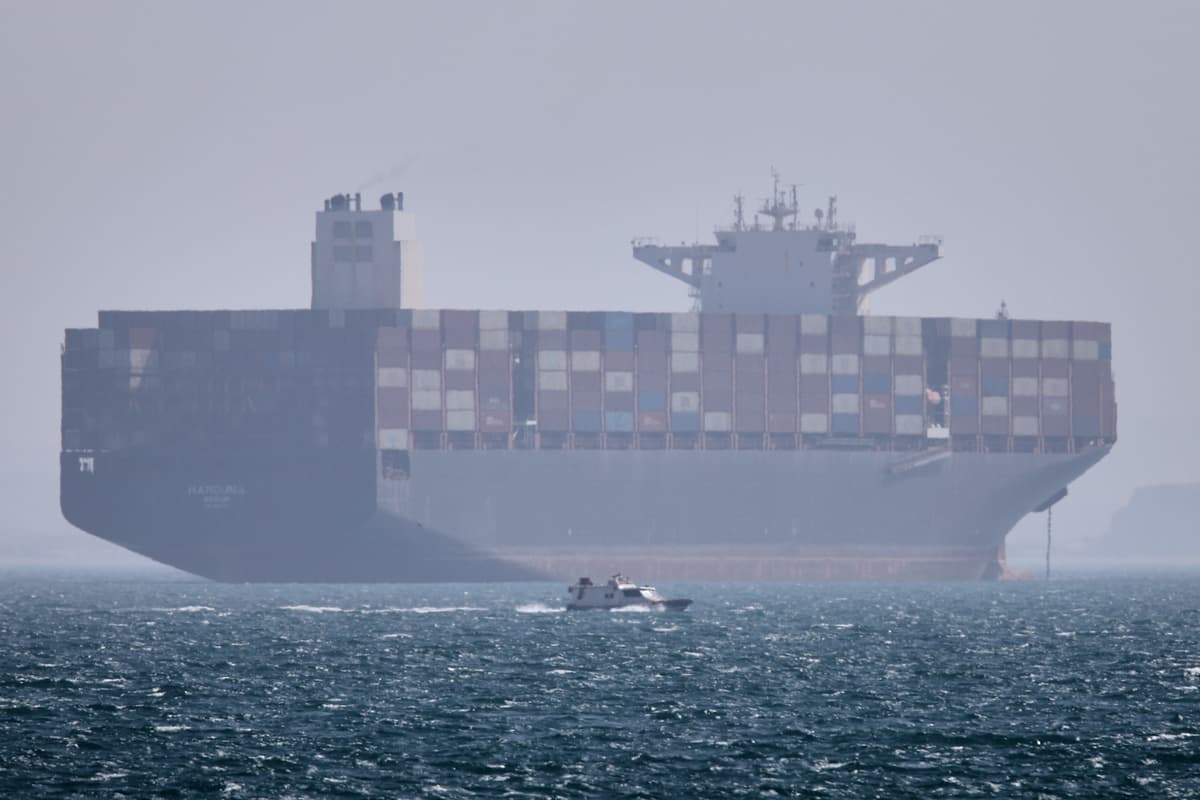 A container ship sits at anchor in the Strait of Hormuz off Bandar Abbas, Iran, May 2, 2026.