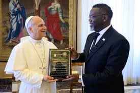 Mayor Brandon Johnson of Chicago presents Pope Leo XIV with a key to the Illinois city of his birth during a visit to the Vatican on May 28, 2026.