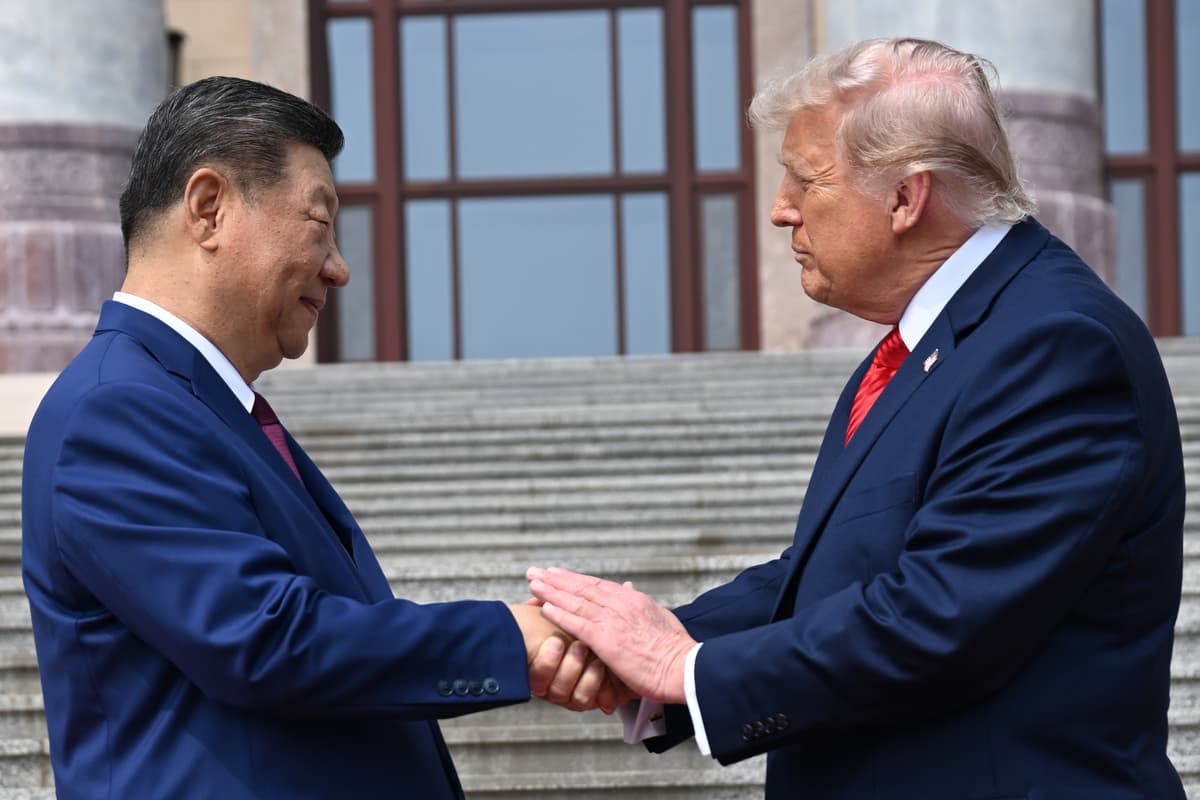 President Xi Jinping, left, shakes hands with President Trump at the Great Hall of the People, Beijing, May 14, 2026.
