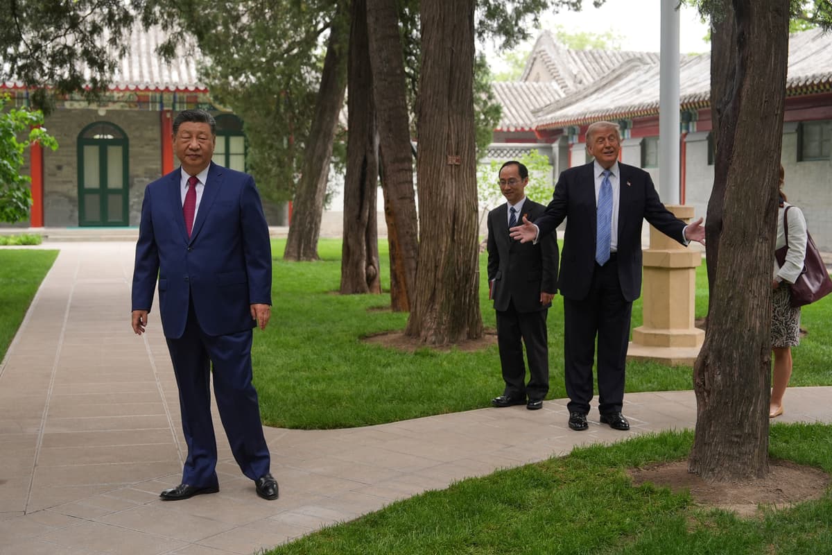 President Trump walks with President Xi Jinping at the Zhongnanhai leadership compound, May 15, 2026, Beijing. 