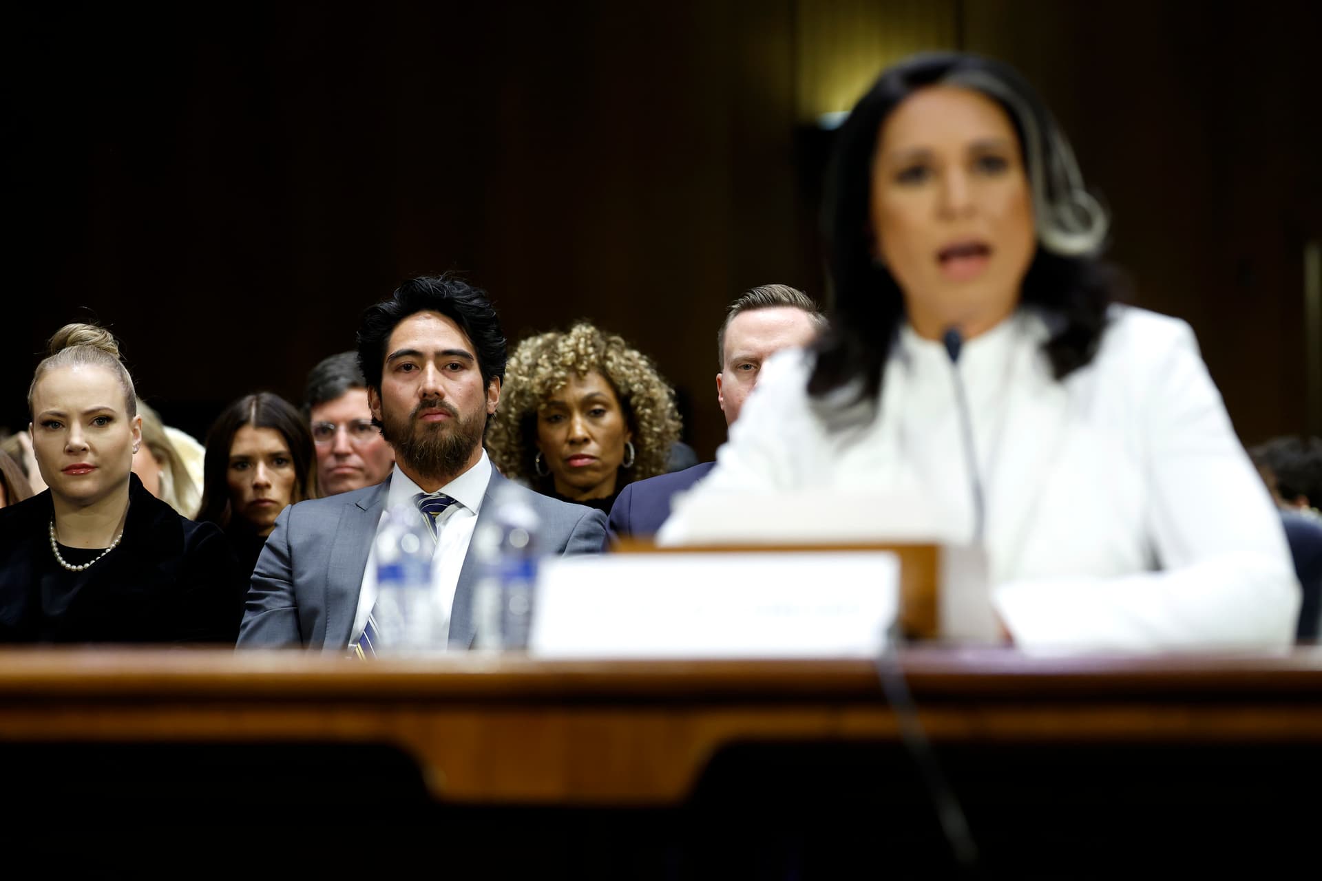 Abraham Williams, husband of Tulsi Gabbard, looks on as she testifies during her confirmation hearing. 