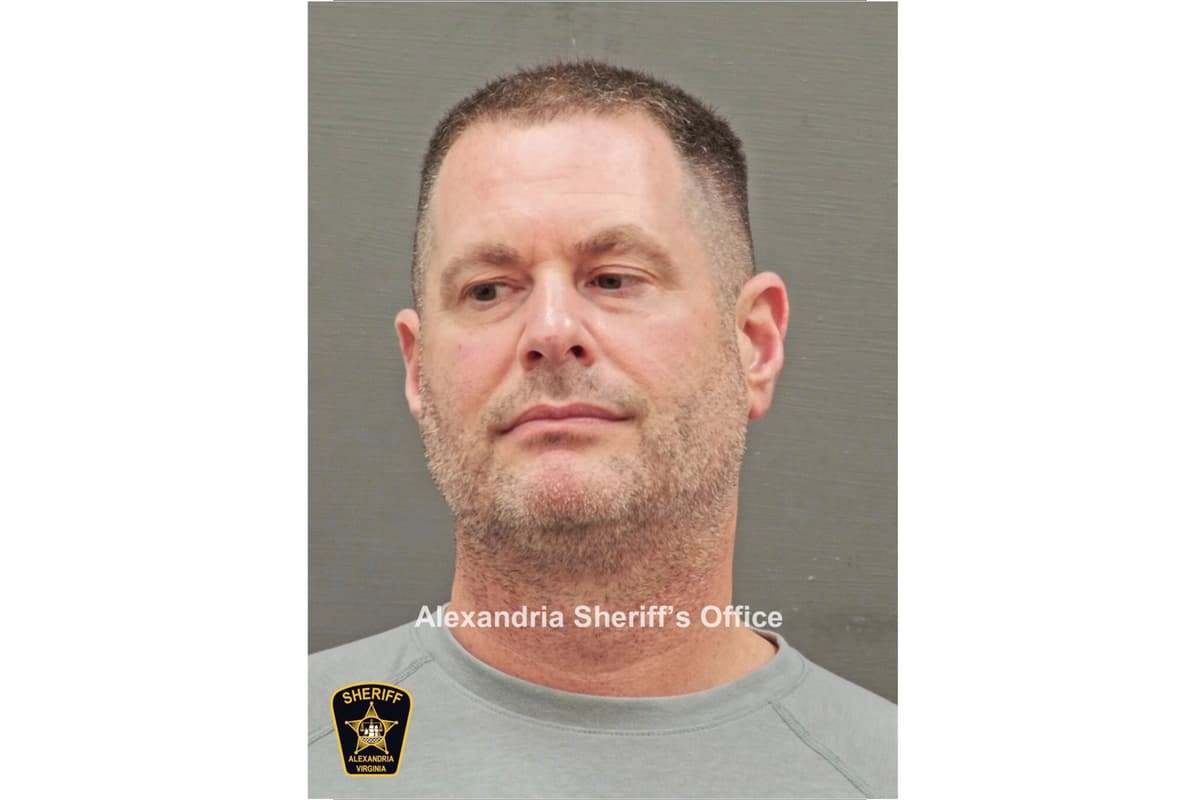 In this image provided and annotated by the Alexandria's Sheriff's Office, David J. Rush is seen in his booking photo at Alexandria, Va