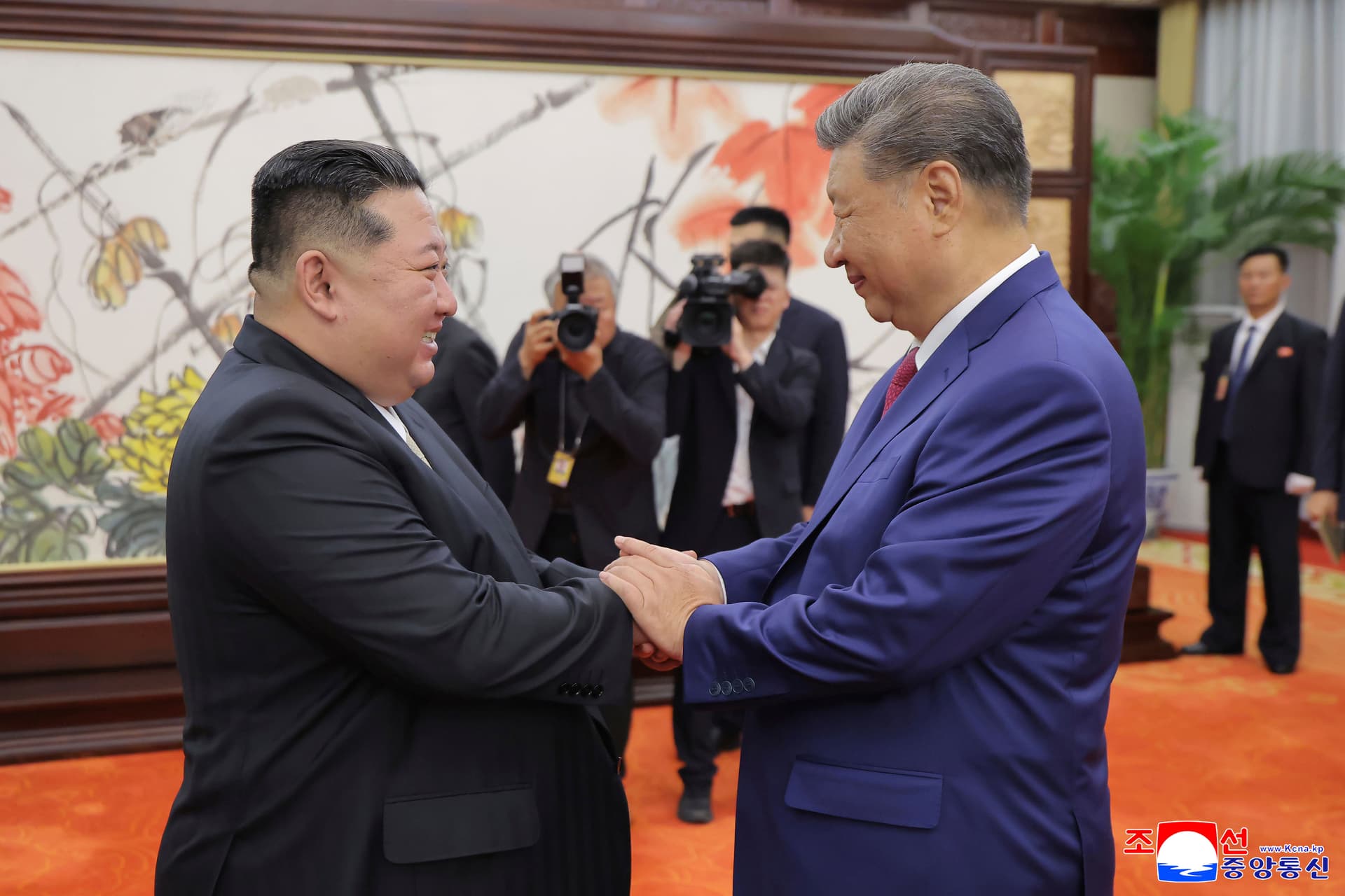 In this photo provided by the North Korean government, North Korean leader Kim Jong-un, left, shakes hands with Chinese President Xi Jinping at Beijing on September 4, 2025. 