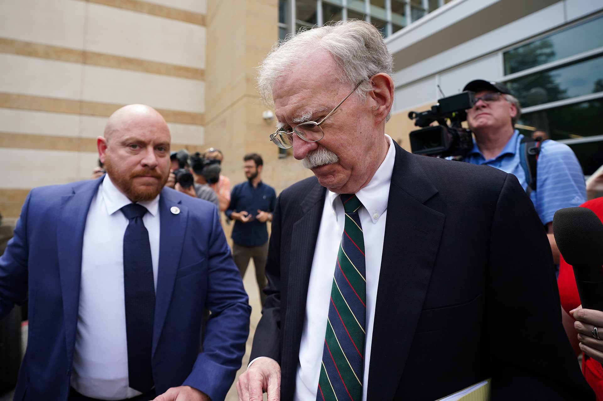 A former national security adviser, John Bolton, departs United States District Court for the District of Maryland at Greenbelt, Maryland, after a plea deal hearing on June 26, 2026.