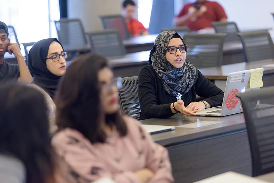 Students participate in a seminar-style class at Northwestern University at Qatar on October 16, 2017.