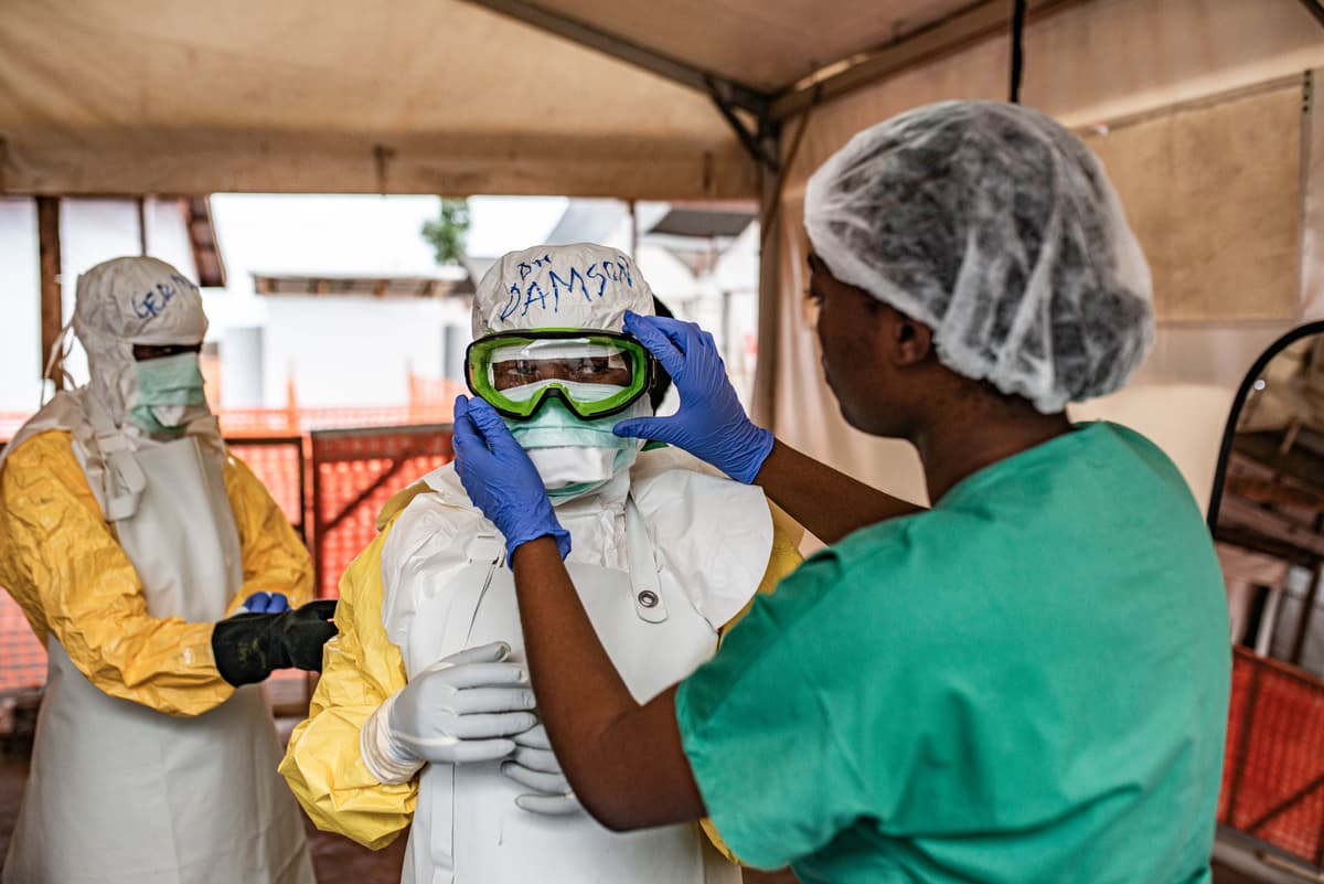 Health care workers don protective equipment at an Ebola treatment center at Monigi, Democratic Republic of Congo, on June 2, 2026.