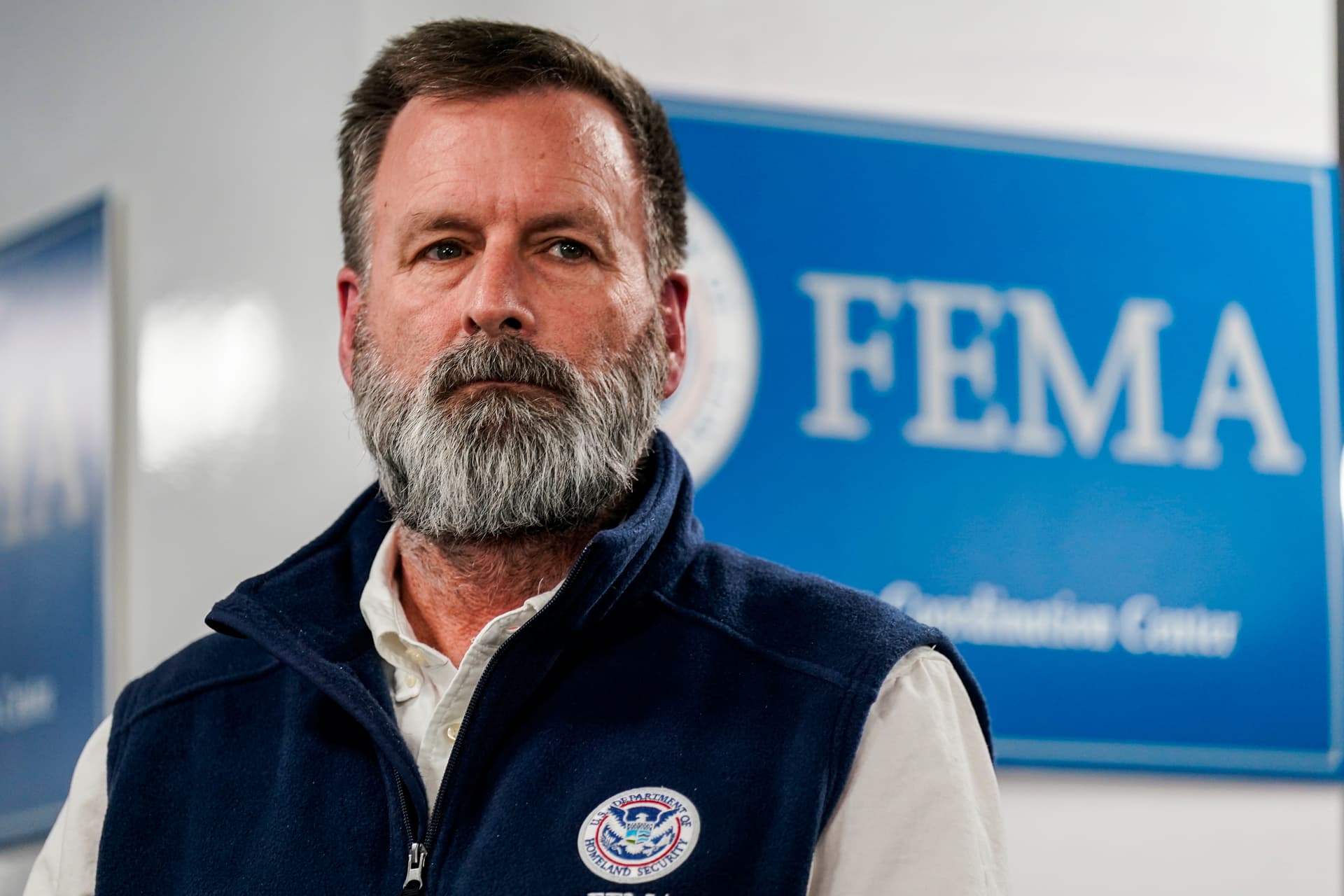 The departing head of FEMA’s Office of Response and Recovery, Gregg Phillips, listens during a news conference at the Federal Emergency Management Agency headquarters at Washington, D.C., on January 24, 2026.