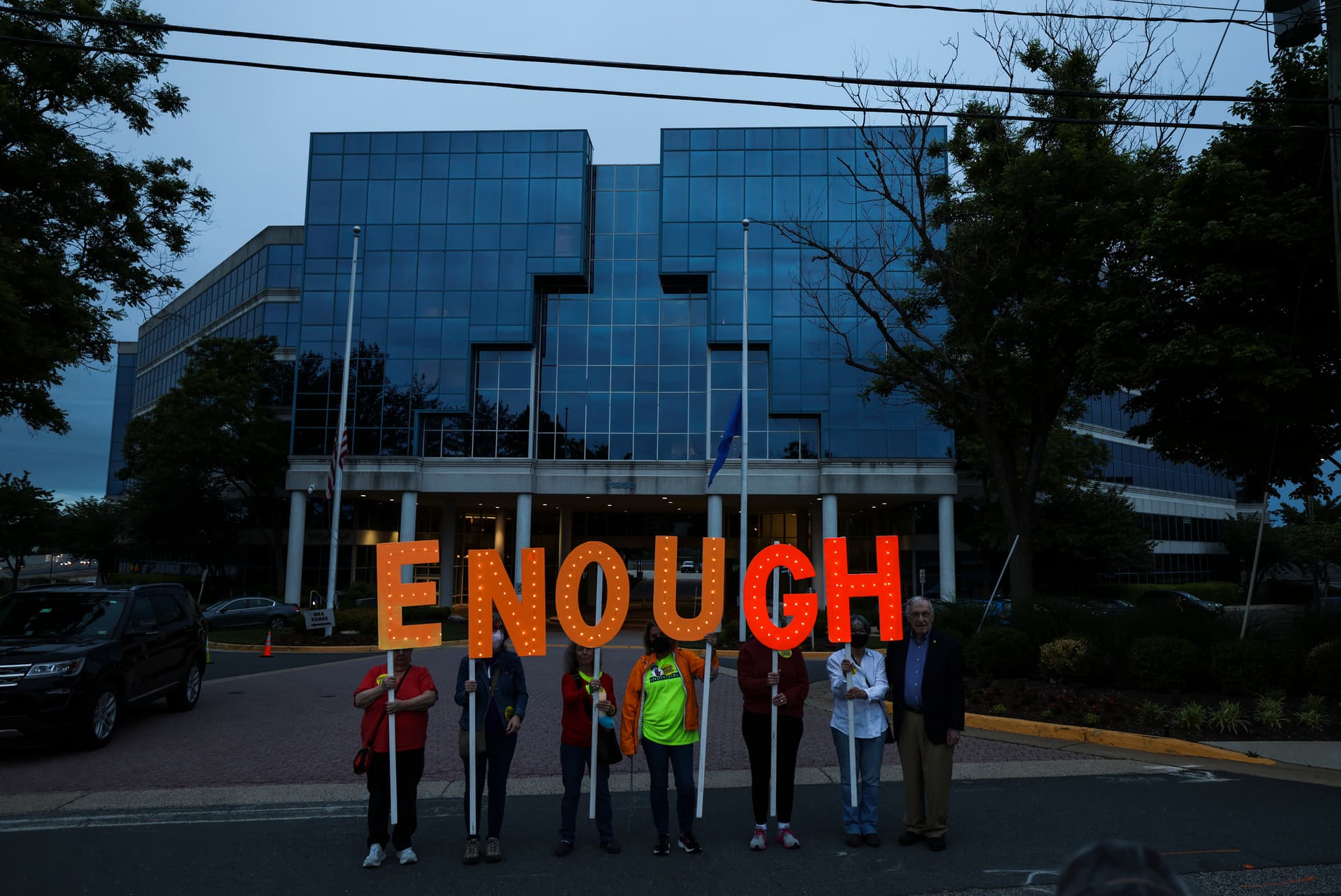 Gun-control advocates hold a vigil outside of the National Rifle Association headquarters following a mass shooting at Robb Elementary School in Fairfax, Virginia, on May 25, 2022.