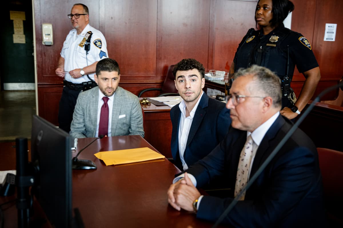 Luigi Mangione appears with lawyers Jacob Kaplan and Marc Agnifilo at a hearing at Manhattan Criminal Court on June 17, 2026, at New York City. Mr. Mangione is charged with murder in the shooting of UnitedHealthcare CEO Brian Thompson at Manhattan in December 2024. 