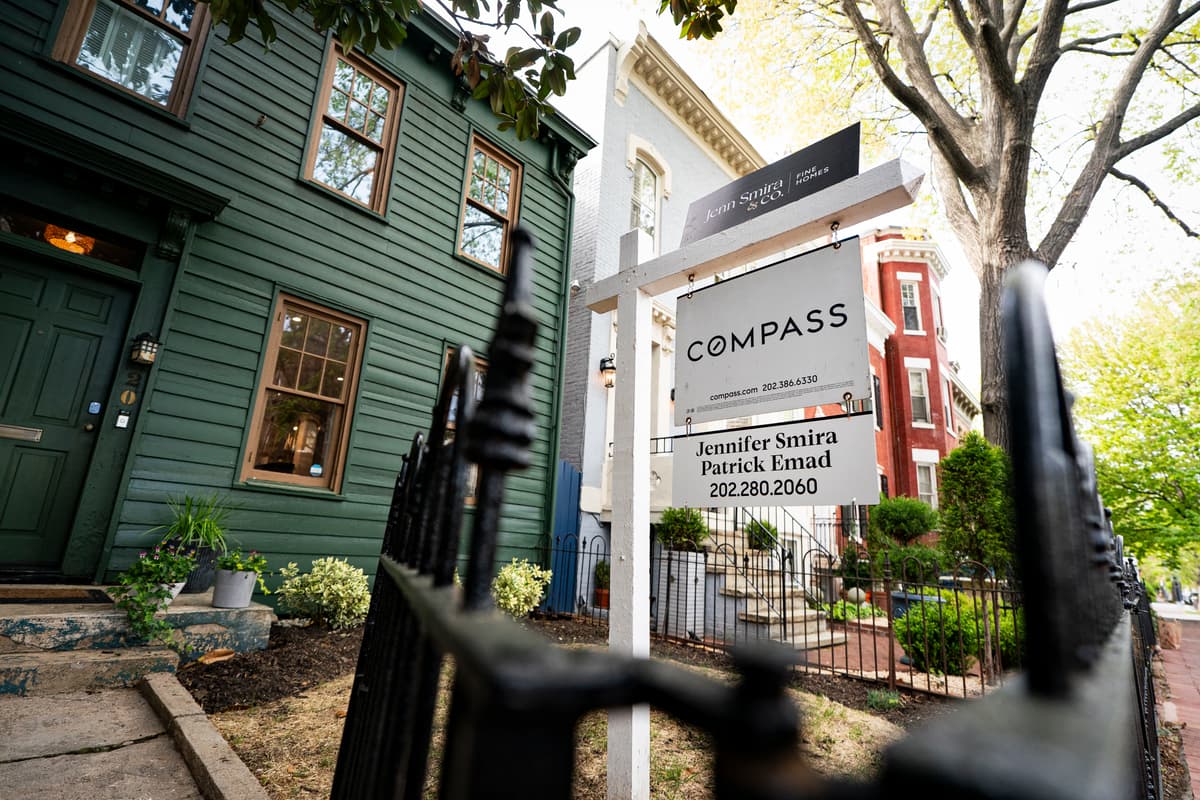 A real estate sign outside of a house for sale at Washington, D.C., on April 12, 2026. Rising home prices are a factor in a record number of young adults still living with their parents in their childhood homes.
