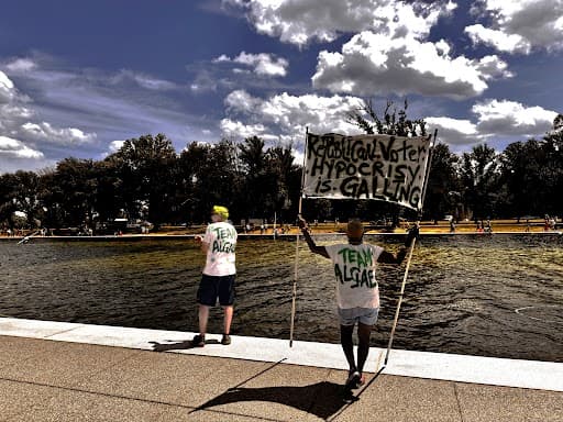 Critics of President Trump’s restoration work at the Lincoln Memorial Reflecting Pool appeared to be celebrating problems with the project, including peeling paint and a persistent algae bloom, on June 19, 2026.