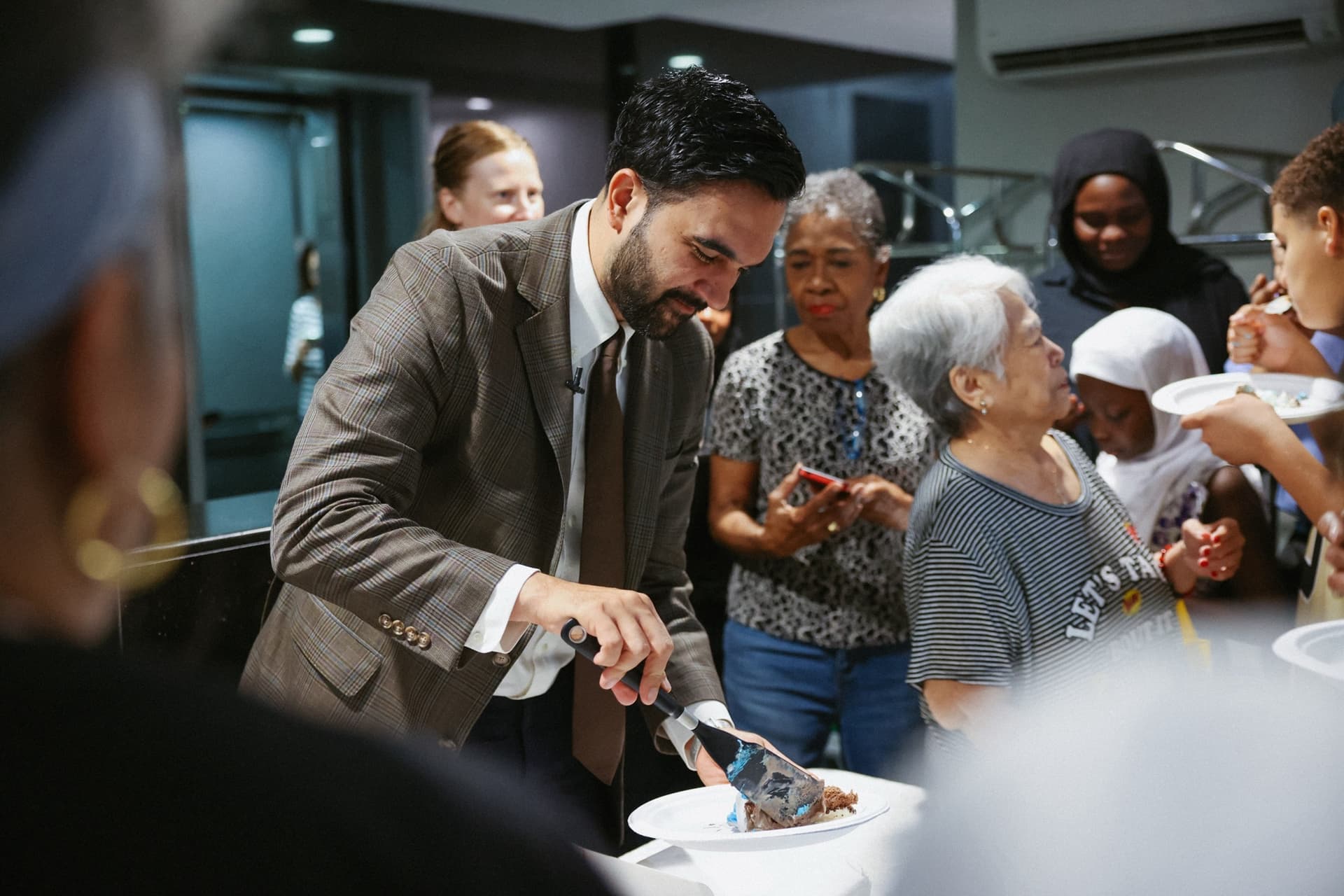 New York City Mayor Zohran Mamdani celebrates a rent freeze on landlords with an ice cream cake for tenants of Lenox Hill Terrace at East Harlem, June 26, 2026.