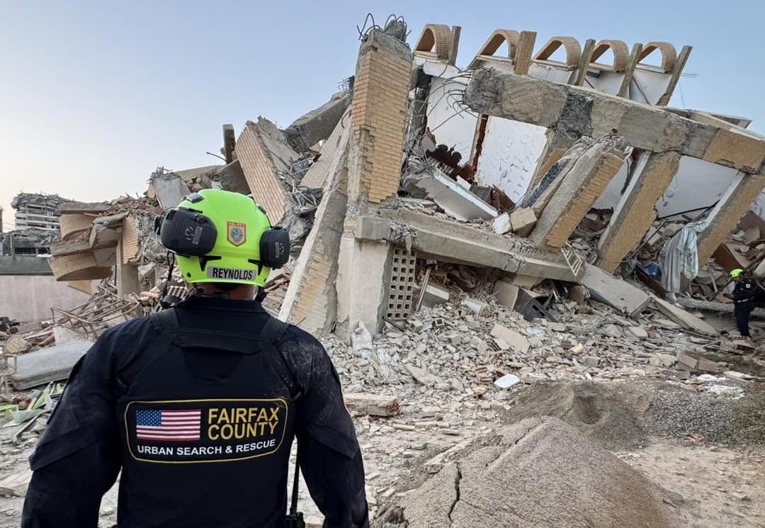 A member of the Fairfax County, Virginia, urban search and rescue team surveys a collapsed building in Venezuela on June 27, 2026.