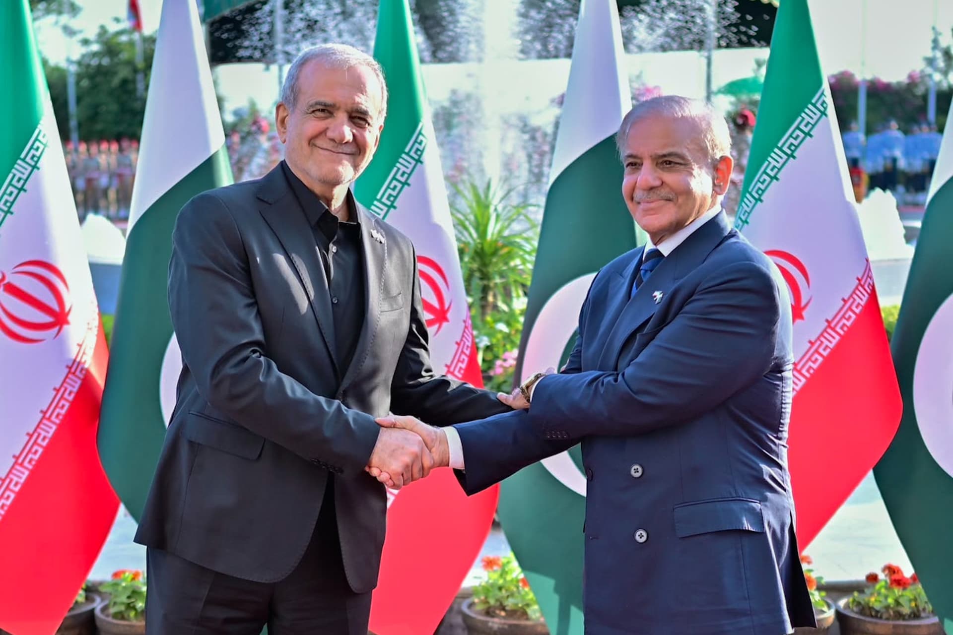 President Masoud Pezeshkian of Iran, left, shakes hands with Prime Minister Shehbaz Sharif of Pakistan at Islamabad, Pakistan, June 23, 2026. 