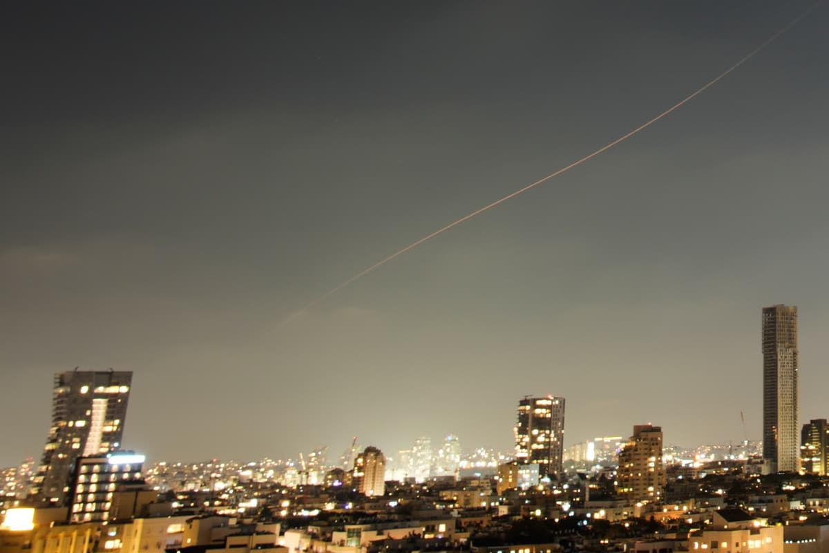 A projectile streaks through the sky over central Israel during an Iranian missile attack, June 7, 2026. 