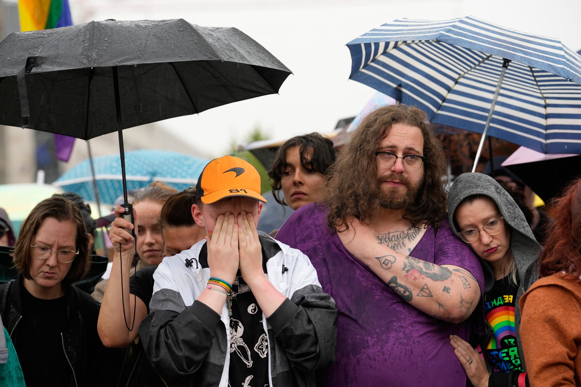 People gather outside the Brandenburg Gate for a demonstration in support of LGBTQ+ after a car driven by a suspected Islamic extremist rammed into a crowd at the Pride March at Berlin, July 26, 2026. 