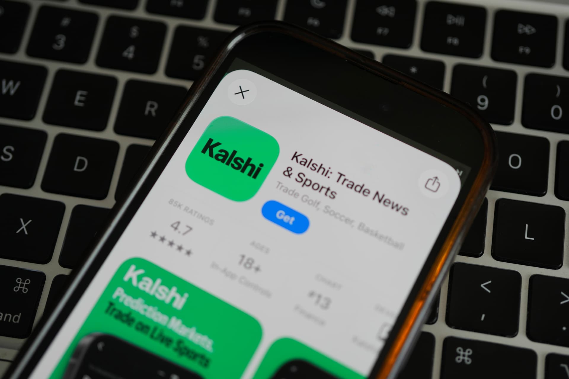 An ad for the prediction market app Kalshi is displayed on a mobile phone at Chicago on April 16, 2026.