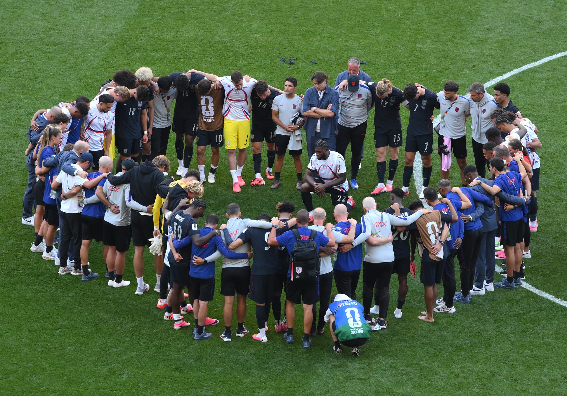 U.S. players and team officials huddle after the team's 1-4 loss during the FIFA World Cup 2026 Round of 16 match between the United States and Belgium at Seattle Stadium on July 06, 2026, at Seattle, Washington. 