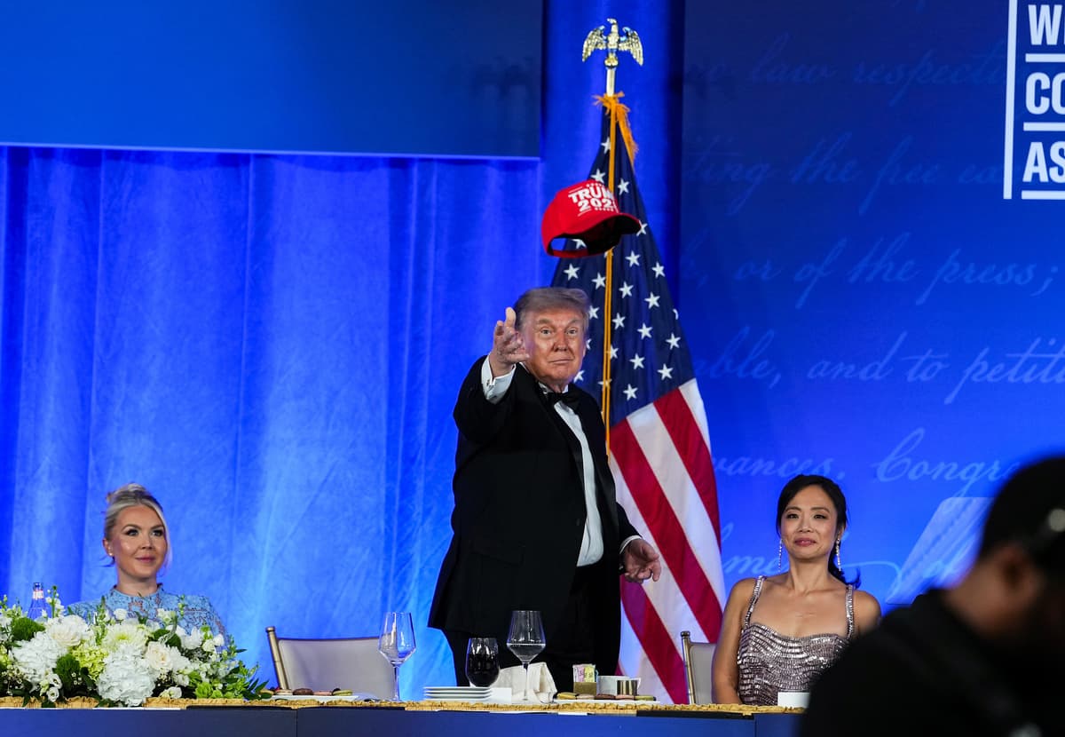 President Donald Trump tosses a TRUMP 2028 hat to an attendee during the rescheduled White House Correspondents Dinner at the Waldorf Astoria at Washington, D.C., on July 24, 2026. 