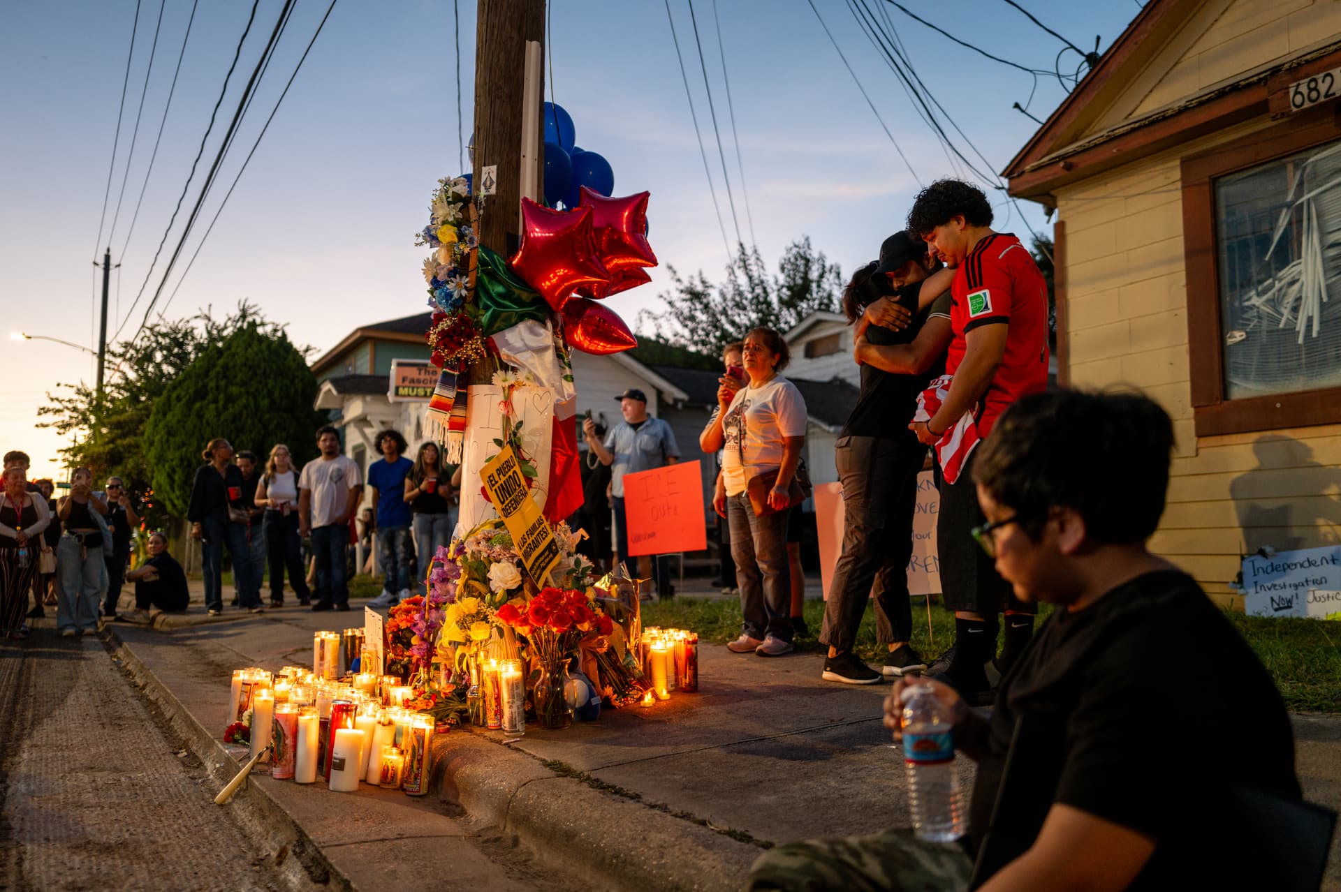 Family members of Mexican immigrant Lorenzo Salgado Araujo grieve at a makeshift memorial during a candlelight vigil at Houston, Texas, on July 8, 2026.