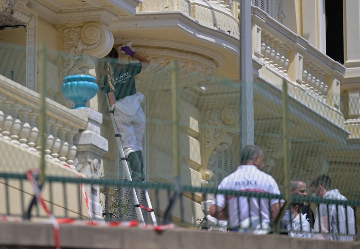 An investigator examines the scene at Monaco on June 30, 2026, at the residential building where an explosive device seriously injured three people a day earlier.