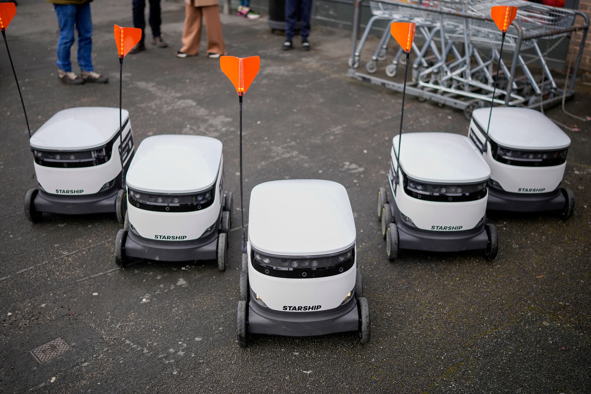 Starship Technologies robotic vehicles park outside a supermarket at Manchester, England, on March 15, 2023.