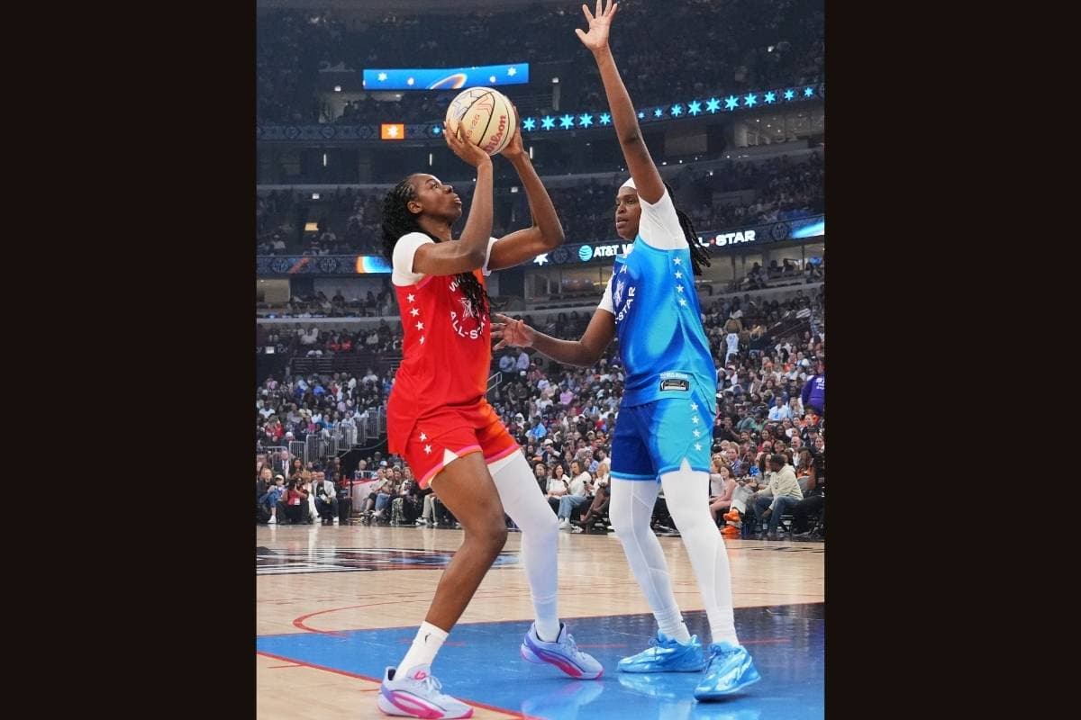 Team Spoon's Jonquel Jones, right, guards against Team Coop's Dominique Malonga during the second half of the WNBA All-Star basketball game at Chicago, July 25, 2026. 