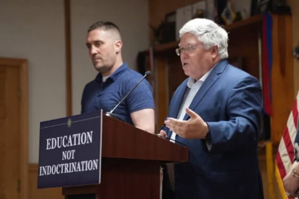 West Virginia’s governor, Patrick Morrisey, appears with the state’s House of Delegates majority leader, Pat McGeehan, at the ceremonial signing of a bill creating a new civics center at Chester, West Virginia, on June 26, 2025.