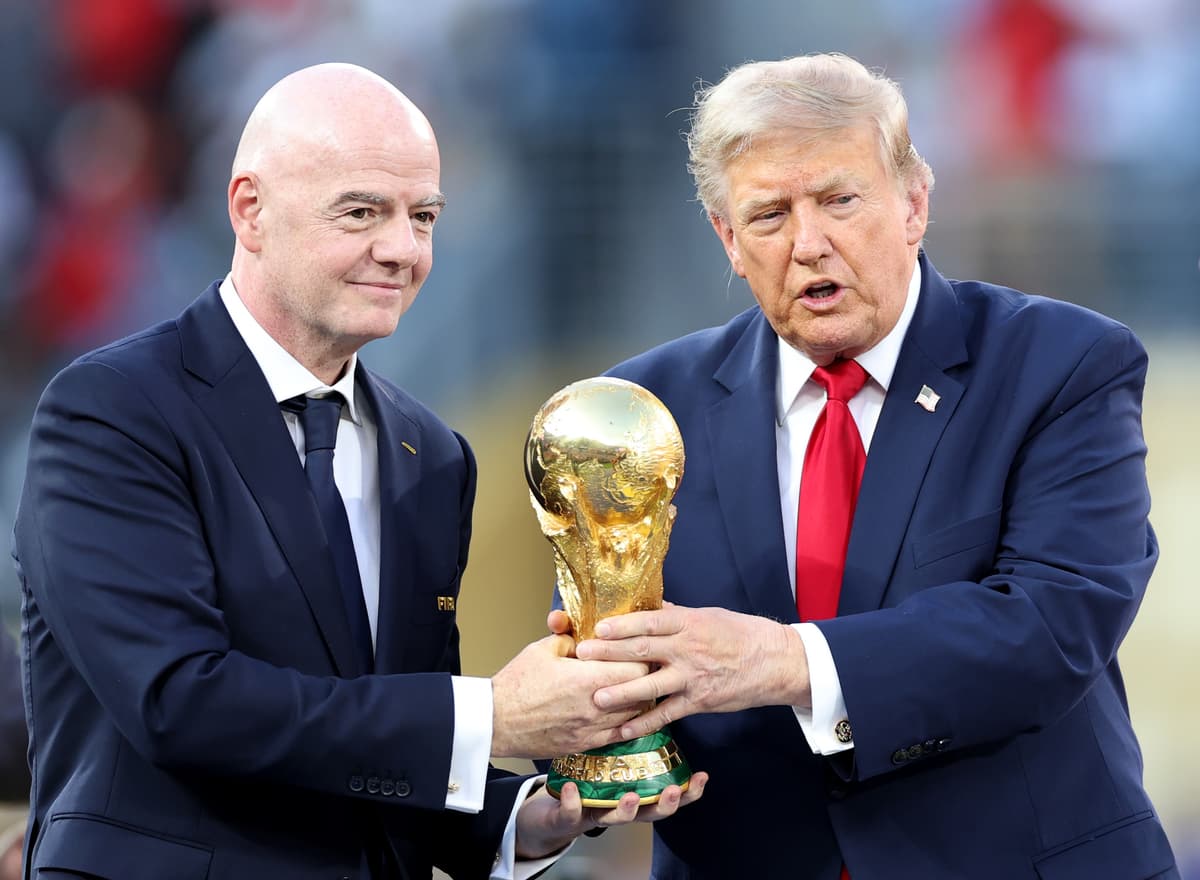 President Trump and FIFA's president, Gianni Infantino, hold the FIFA World Cup Winner's Trophy on July 19, 2026.