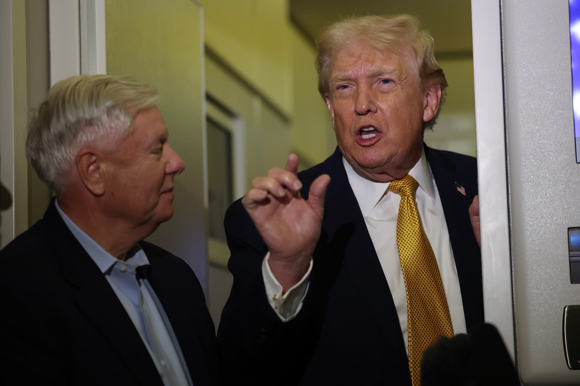 President Trump and Senator Lindsey Graham  speak to the media aboard Air Force One enroute to Washington, DC on January 4, 2026.