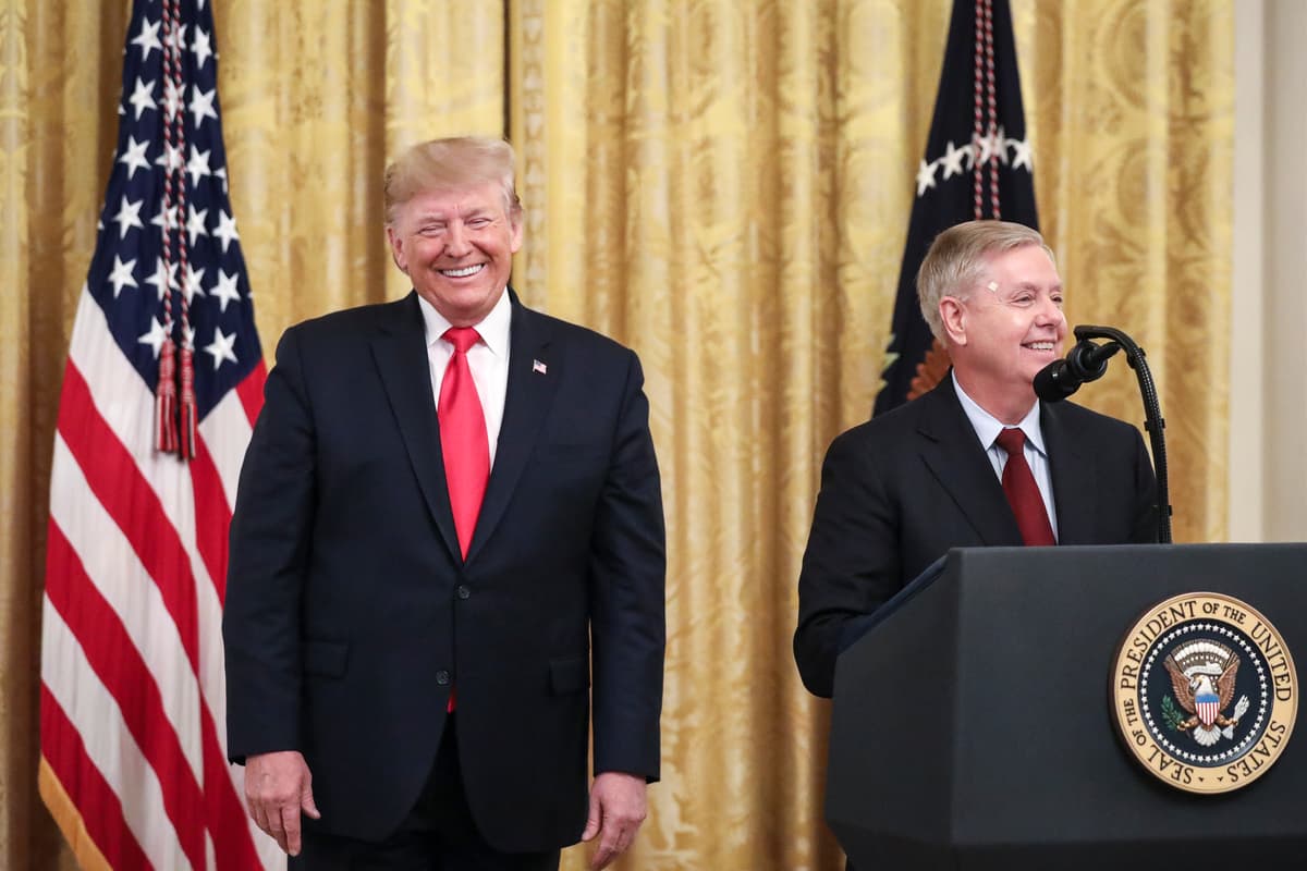 President Trump looks on as Senator Lindsey Graham speaks at the White House on November 6, 2019.