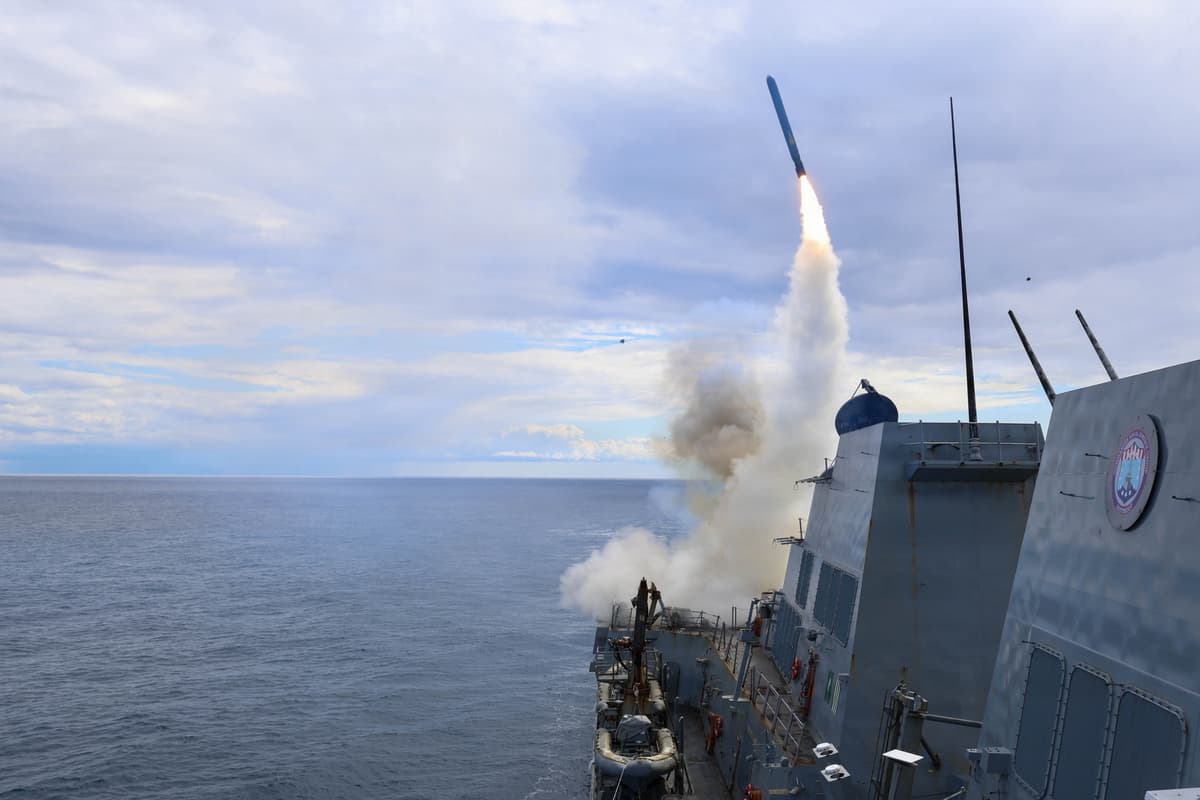 Arleigh Burke-class guided-missile destroyer USS Thomas Hudner fires a Tomahawk missile.