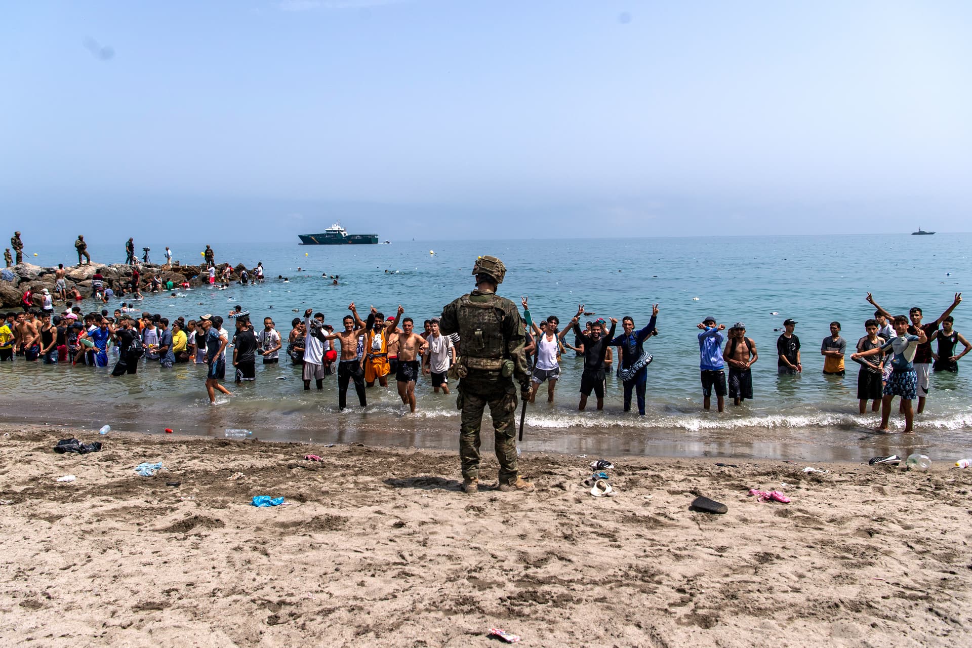 Spanish army soldiers block access to the beach for people crossing from Morocco into the Spanish enclave of Ceuta, July 31, 2026.