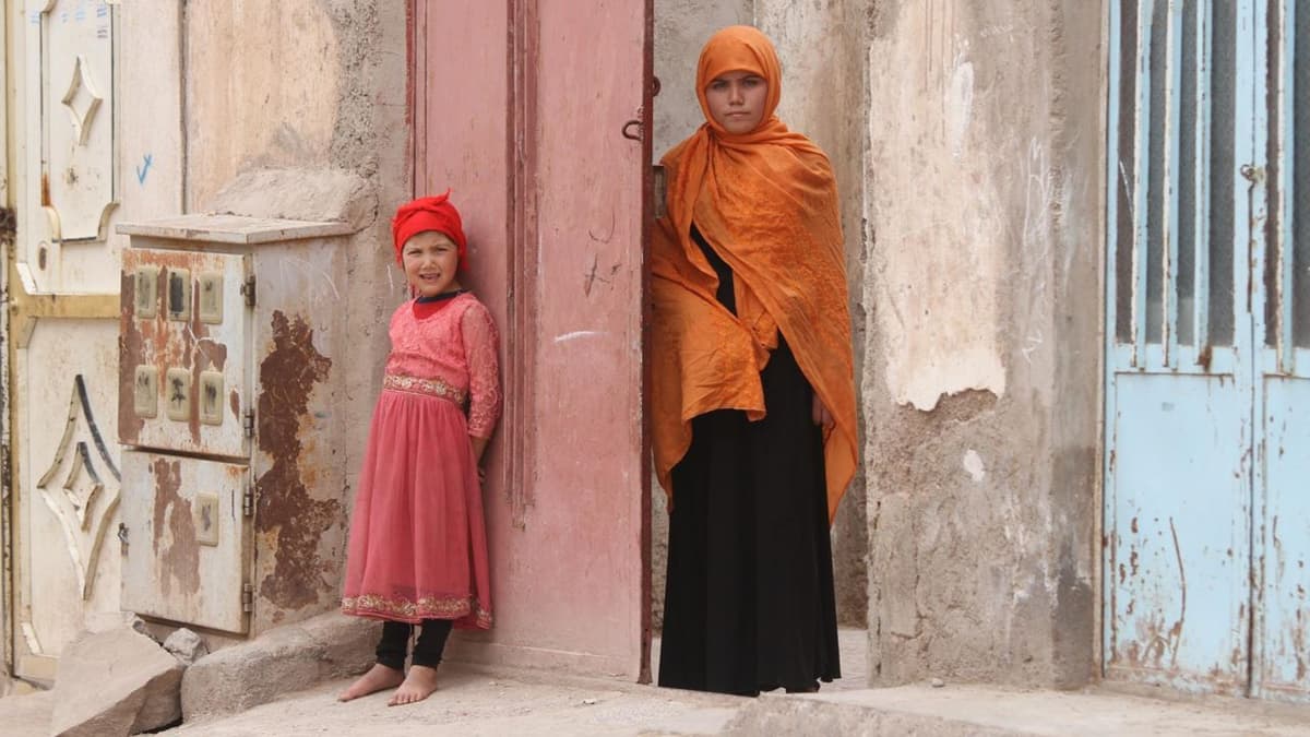 Somaya, right, who was sold into marriage at age 13, is seen at Herat, Afghanistan, in July 2019.