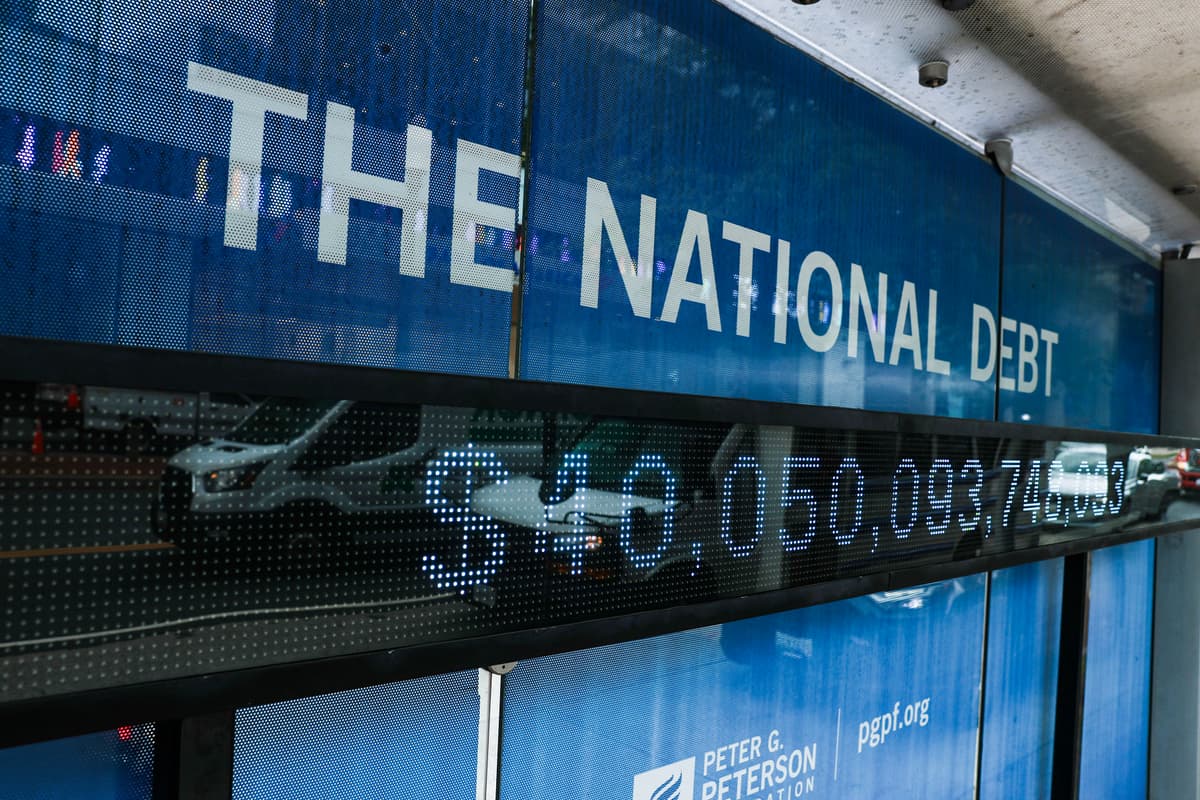 A sign displays the national debt on a bus stop on August 20, 2026 at Washington, D.C. 
