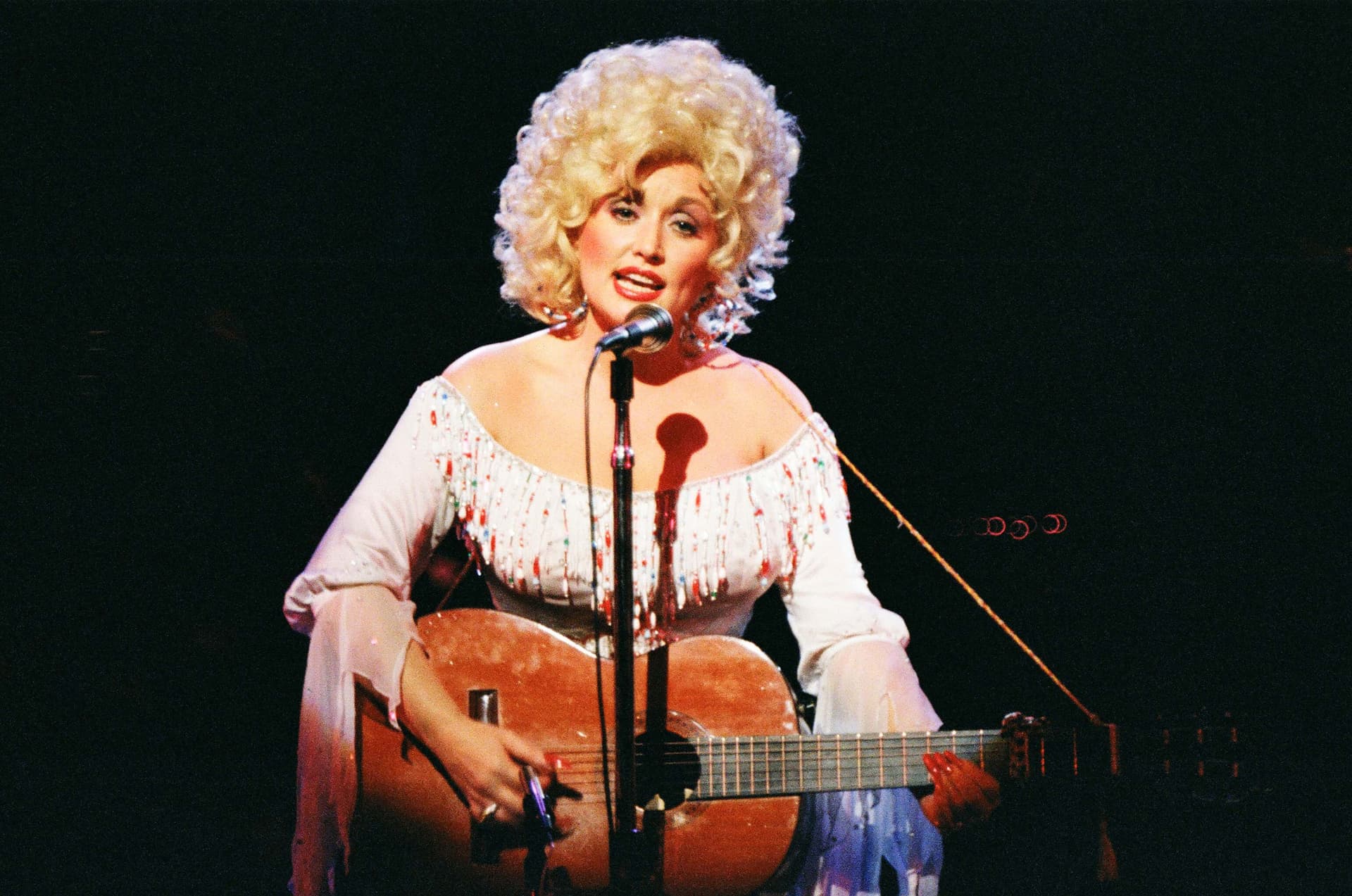 Dolly Parton performs on stage at London's Dominion Theatre on March 29, 1983.