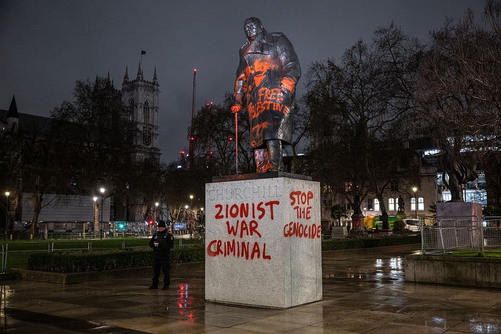 The Churchill statue in Parliament square is vandalised in the early hours of the morning with red paint and pro-Palestine slogans including "Zionist war criminal", "Stop the Genocide", "Never again is Now", "Globalise the Intifada", and what appears to be "Greetings from the Hague" in Dutch on February 27, 2026 at London, England. 