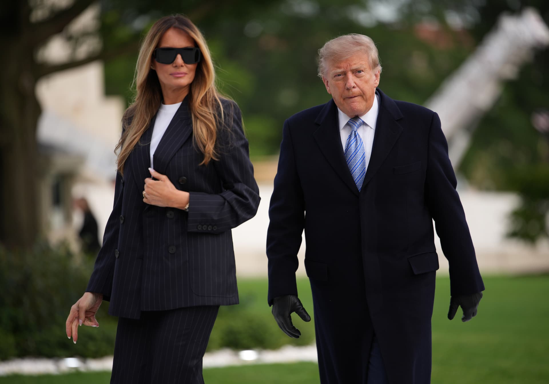 President Trump and first lady Melania Trump walk together after returning to the White House on September 23, 2026.