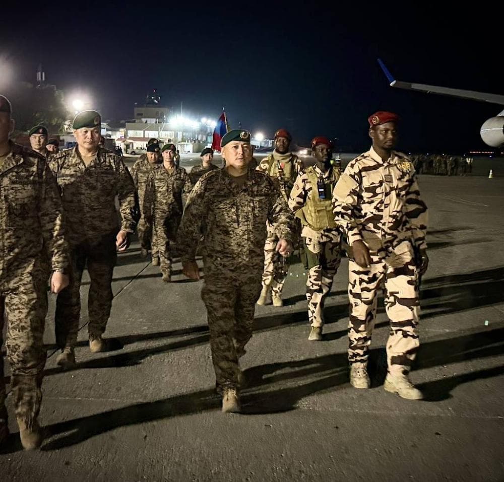Major General Erdenebat Batsuuri of Mongolia, center, arrives at Toussaint Louverture International Airport at Port-au-Prince, Haiti, to take charge of the UN’s new Gang Suppression Force on May 14, 2026.