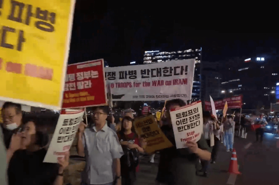 South Korean demonstrators march past the U.S. Embassy at Seoul on September 18, 2026, to demand that President Lee Jae-myung not involve Korean forces in the war in Iran.