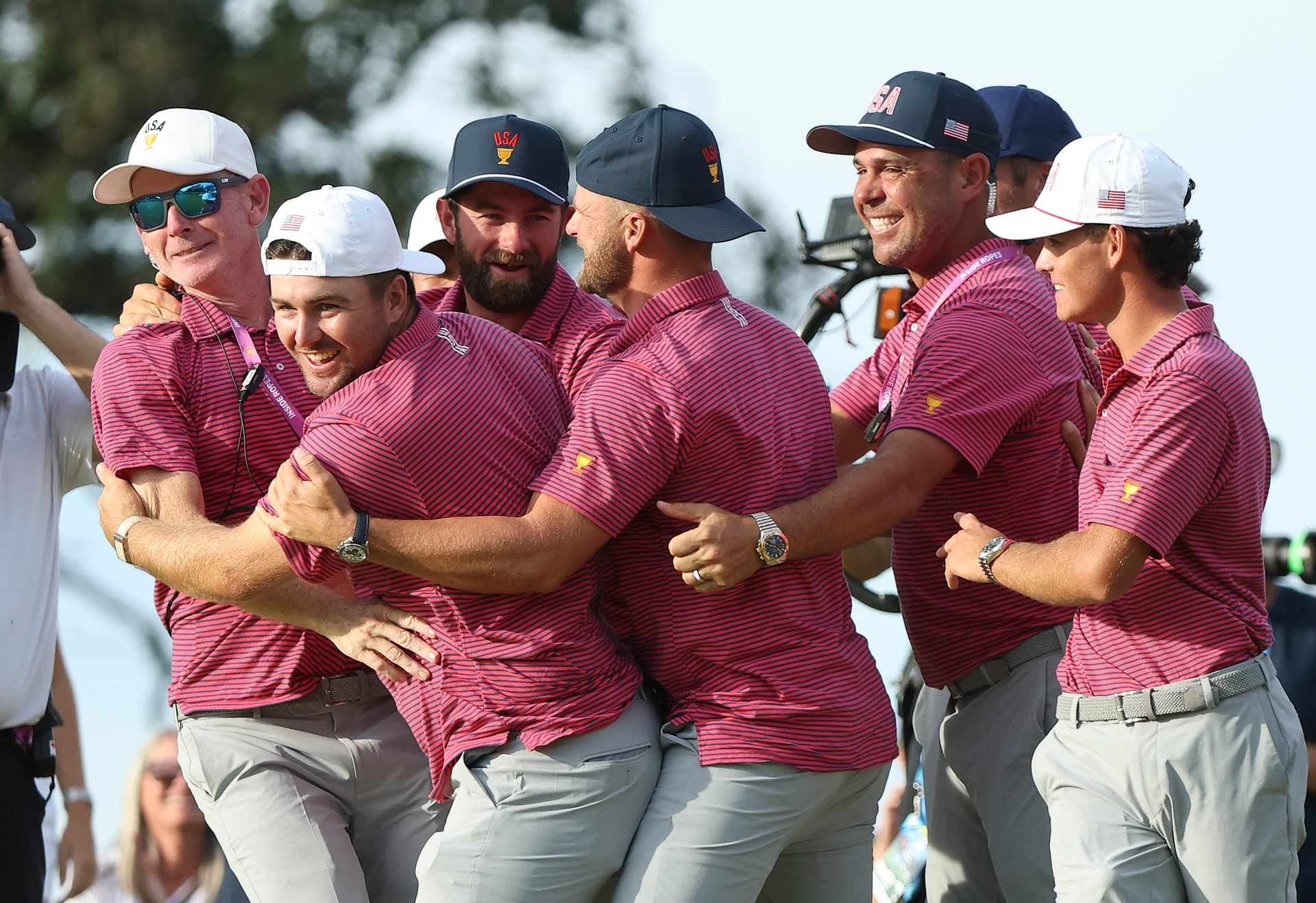 Members of the U.S. Team celebrate after the U.S. Team wins 17-13 on the 18th green during Sunday's Singles on day four of the Presidents Cup 2026 at Medinah Country Club on September 27, 2026 at Medinah, Illinois.