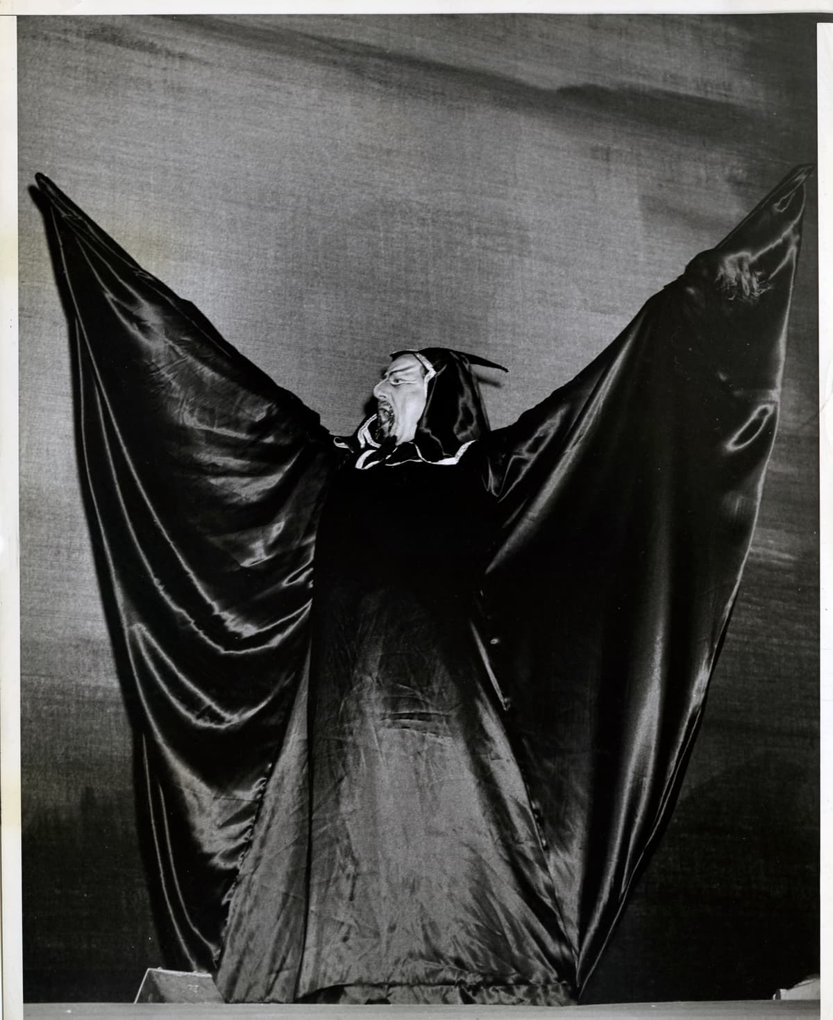 'The Foreman Of The Devils Was Peeved… because the assistant devils were not in costume,' by Weegee, 1945. 
