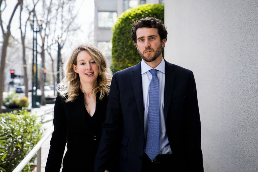 Elizabeth Holmes and her boyfriend Billy Evans leave a hearing at the Robert E. Peckham U.S. Courthouse on March 17 2023 in San Jose, California. 