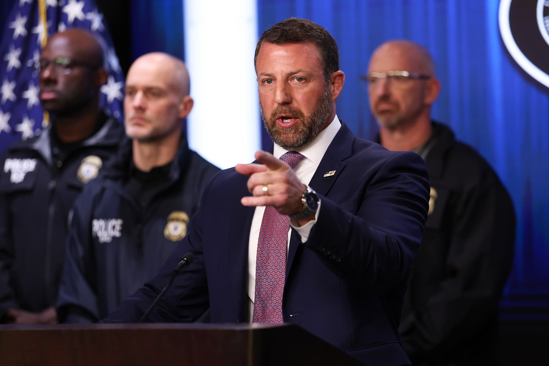 U.S. Secretary of Homeland Security Markwayne Mullin takes questions from reporters during a press conference at U.S. Immigration and Customs Enforcement (ICE) headquarters.