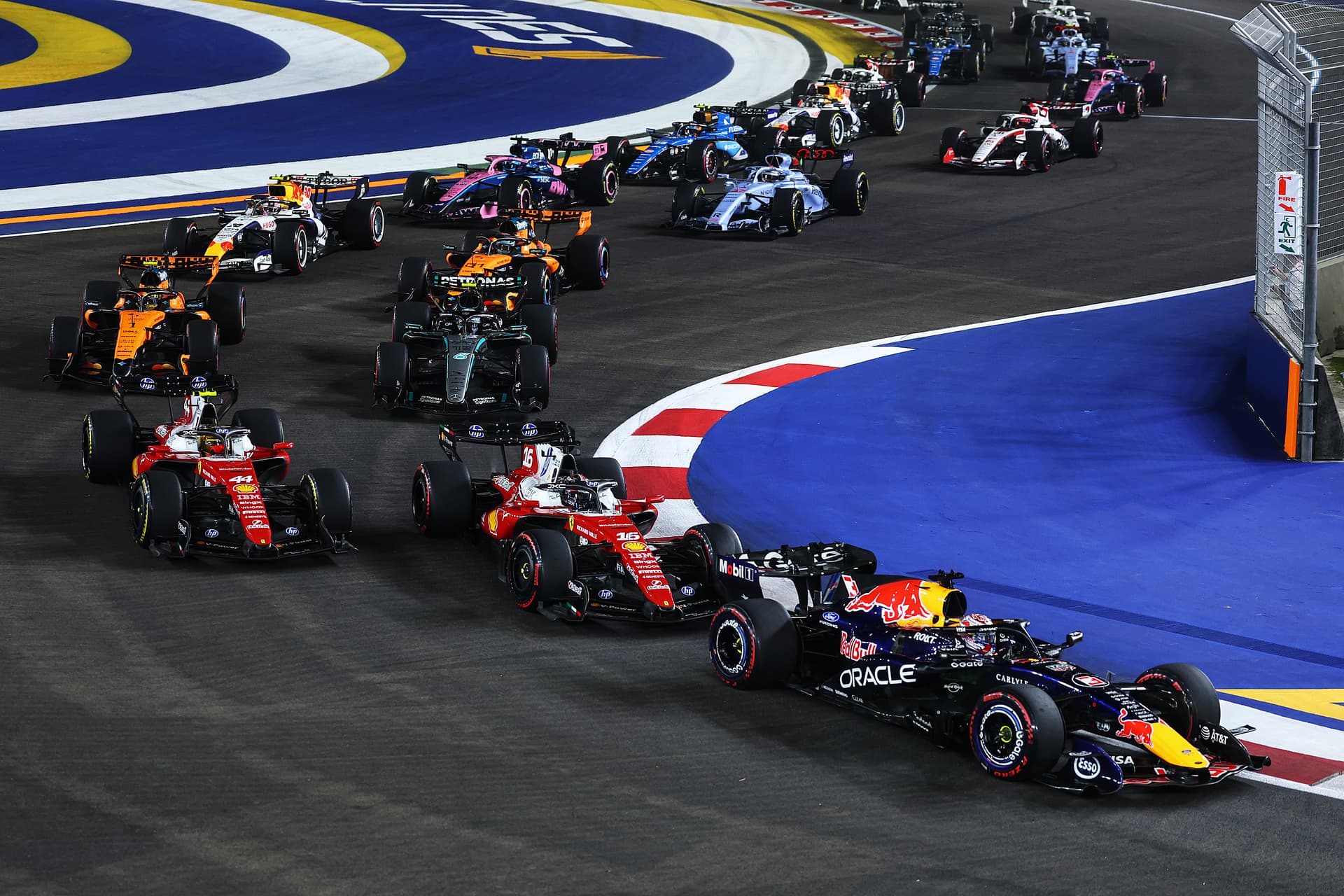 Max Verstappen of the Netherlands driving the (3) Oracle Red Bull Racing RB22 Red Bull Ford Powertrains leads the field at the race start during the F1 Grand Prix of Singapore at Marina Bay Street Circuit on October 11, 2026, at Singapore. 
