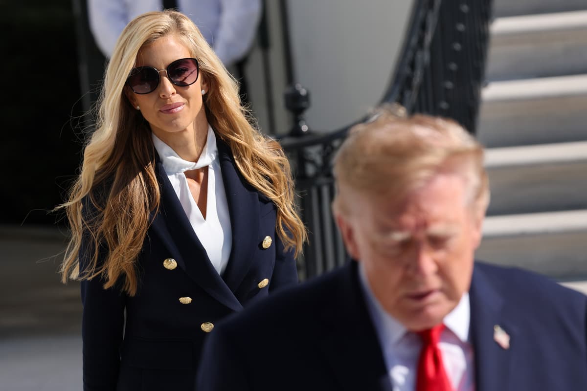 Katie Zacharia joins President Donald Trump as he departs on the South Lawn of the White House.